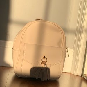 Pink backpack with two bow charms NWT